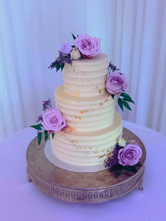 Three Tier Buttercream Wedding Cake with calloped edge, gold leaf and fresh flowers 