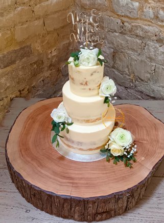 Three Tier Semi-naked Wwedding Cake with fresh flowers